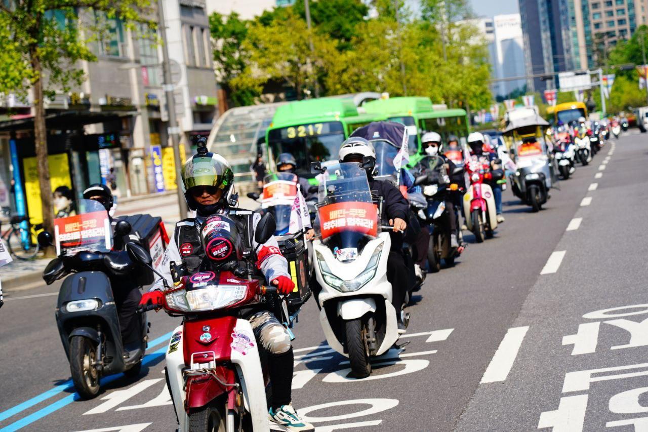 Convoy of motor scooters